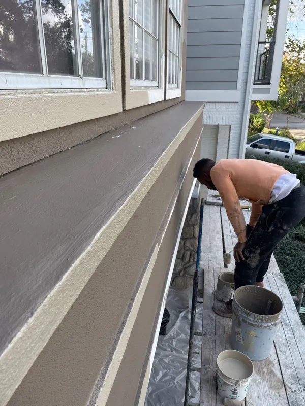 Exterior window and stucco trim in a later project photo