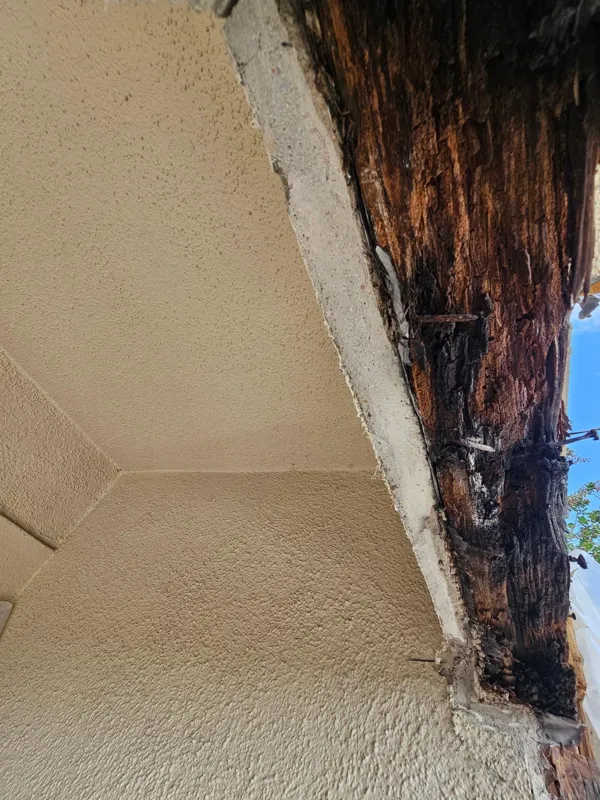 Opened material along the underside of a balcony