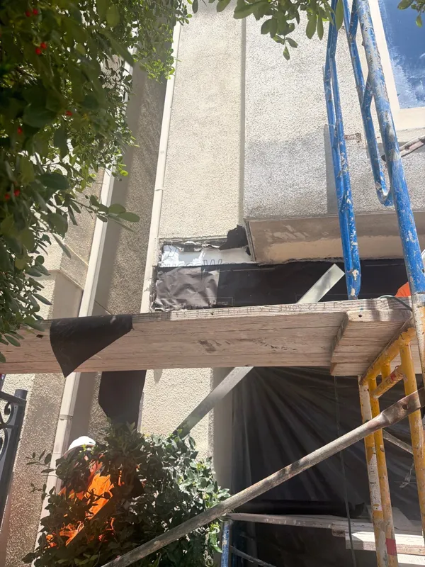 Scaffolding beside the balcony repair area