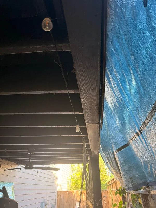Protected doorway and adjoining exterior work area