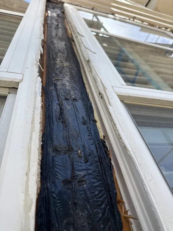Opened stucco along a window edge