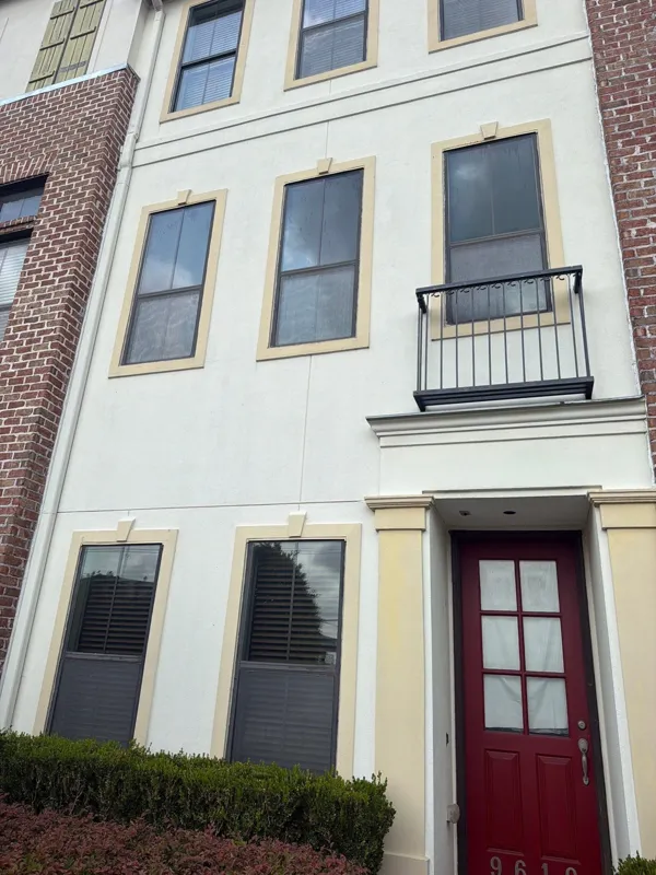 Brick and light stucco townhome facade