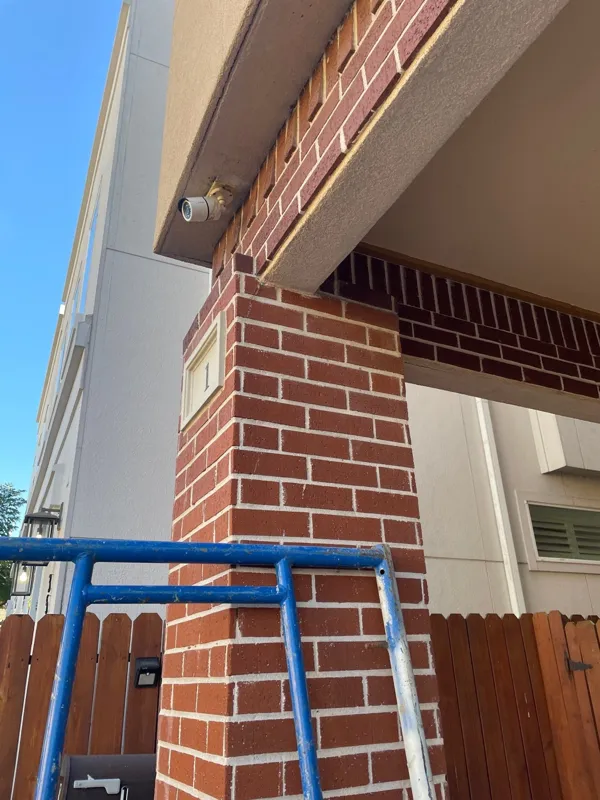 Opened exterior trim above brickwork