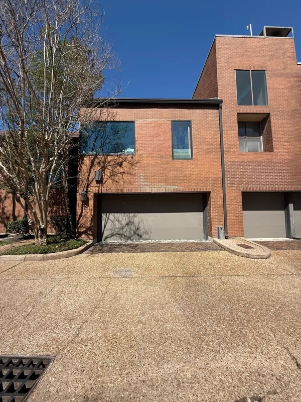 Brick townhome and driveway documented for a foundation assessment