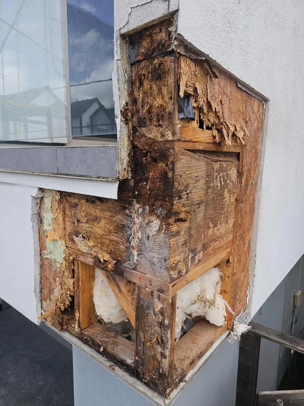 Exposed wood around the corner of a window bay