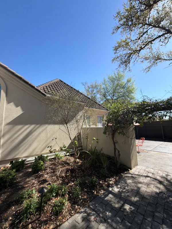 Later view of the courtyard wall and adjacent planting