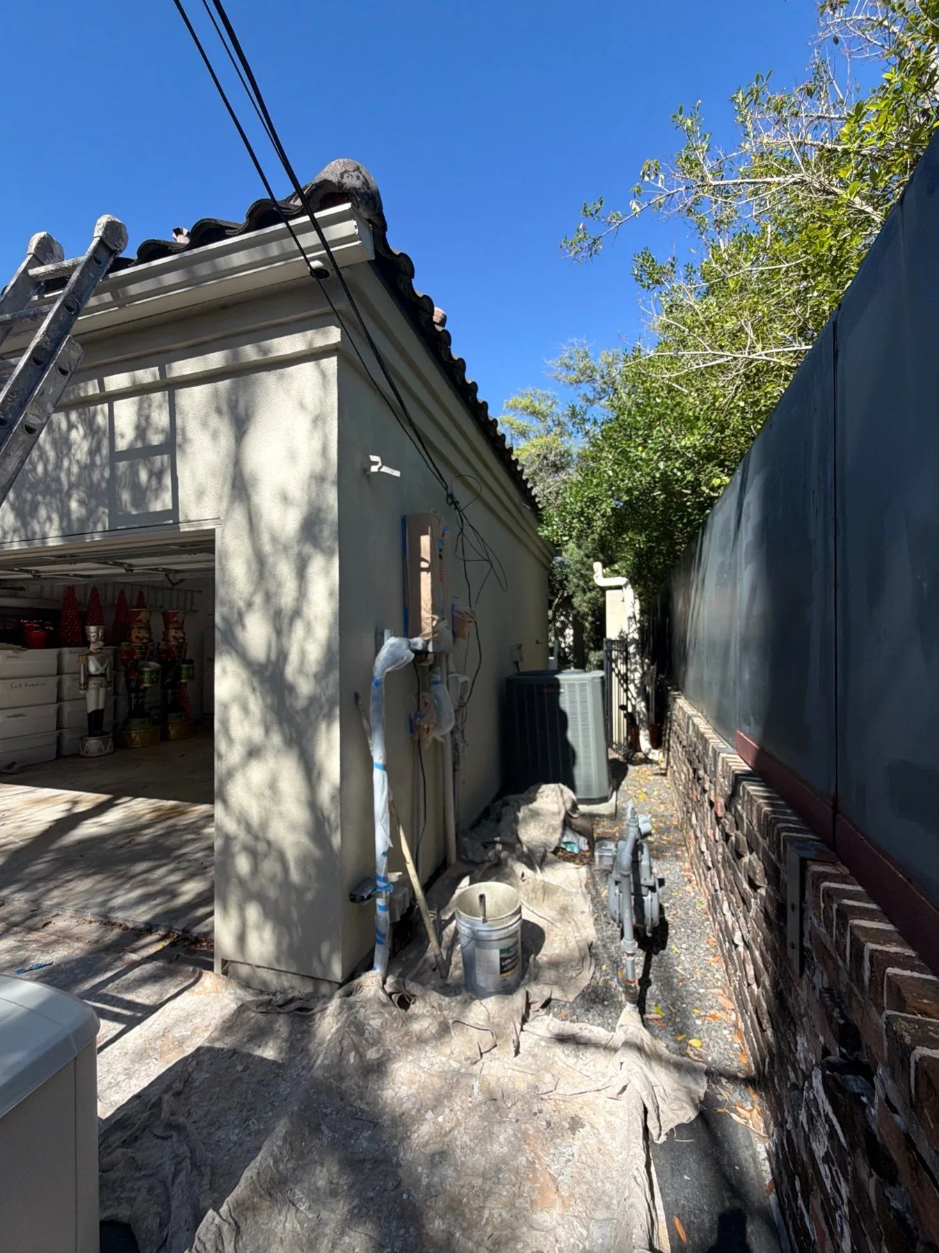 Later exterior wall and column with protected paving