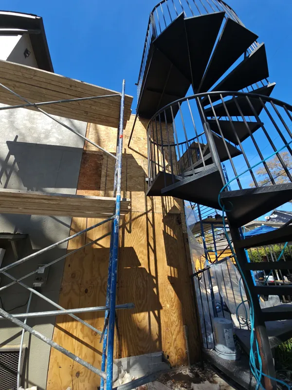 Scaffolding and stair structure beside the exterior wall