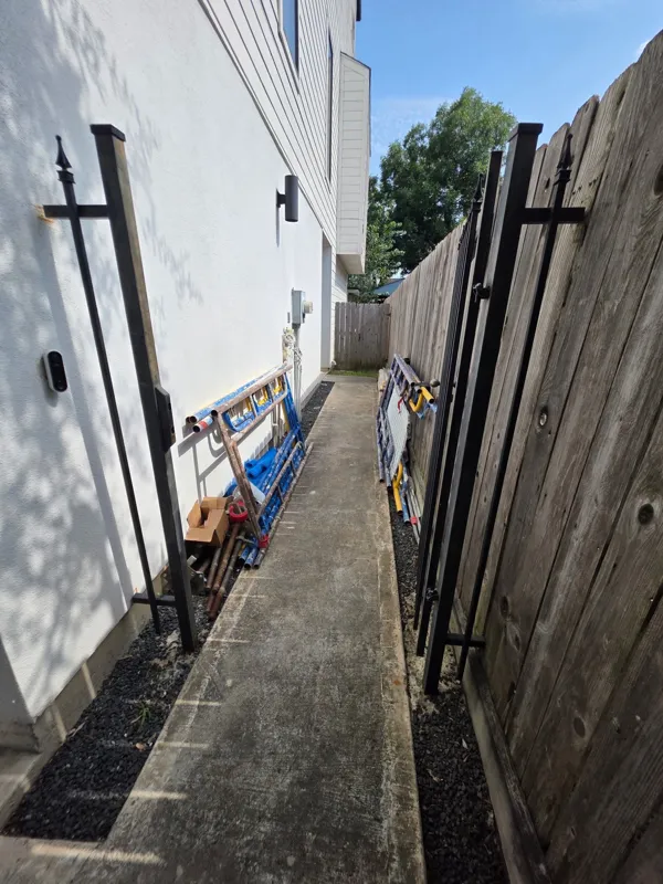 Narrow side passage beside exterior work