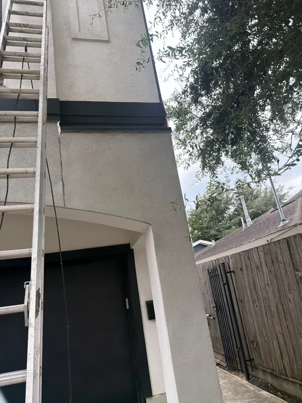 Repaired exterior corner beside the garage