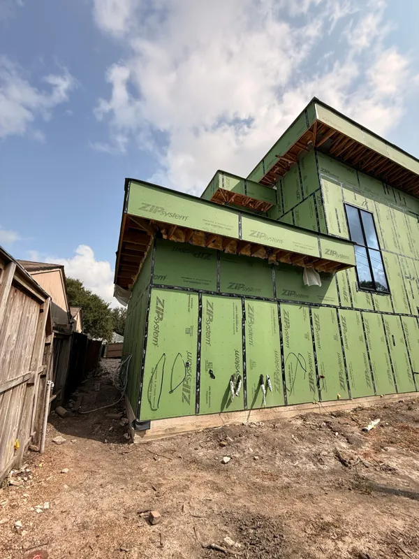 Sheathing and window openings along the side of the home