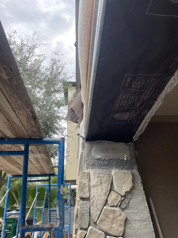 Exterior corner and supporting detail beneath the patio roof