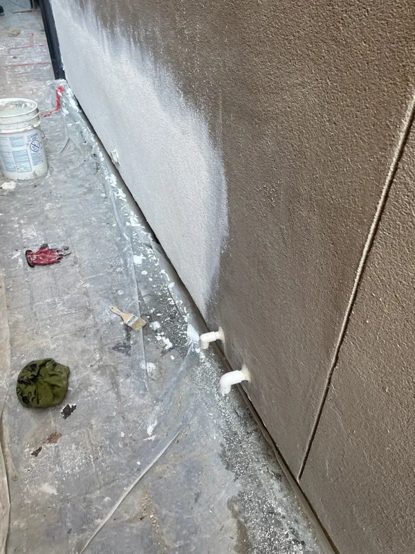 Fresh stucco surface beside the patio floor