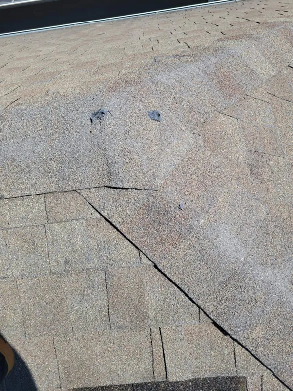 Close view of overlapping shingles and a surface transition