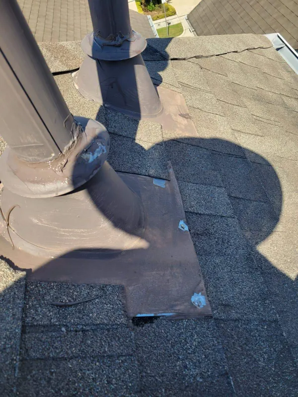 Roof vent and flashing where they meet the shingles