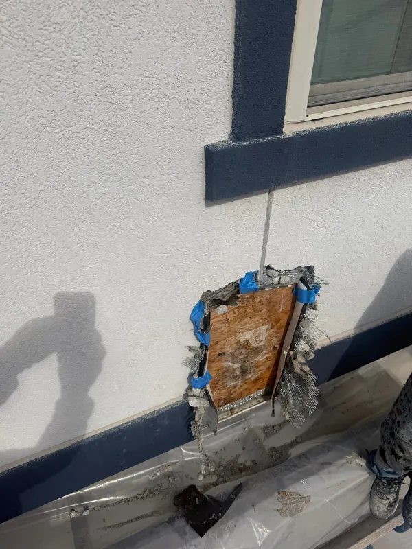 Localized wall repair beneath an exterior window