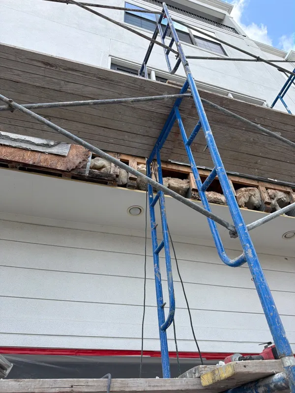 Scaffolding set up above a garage opening