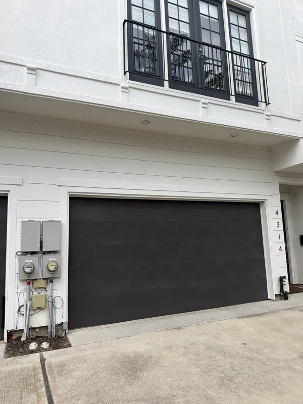 White facade and black garage door