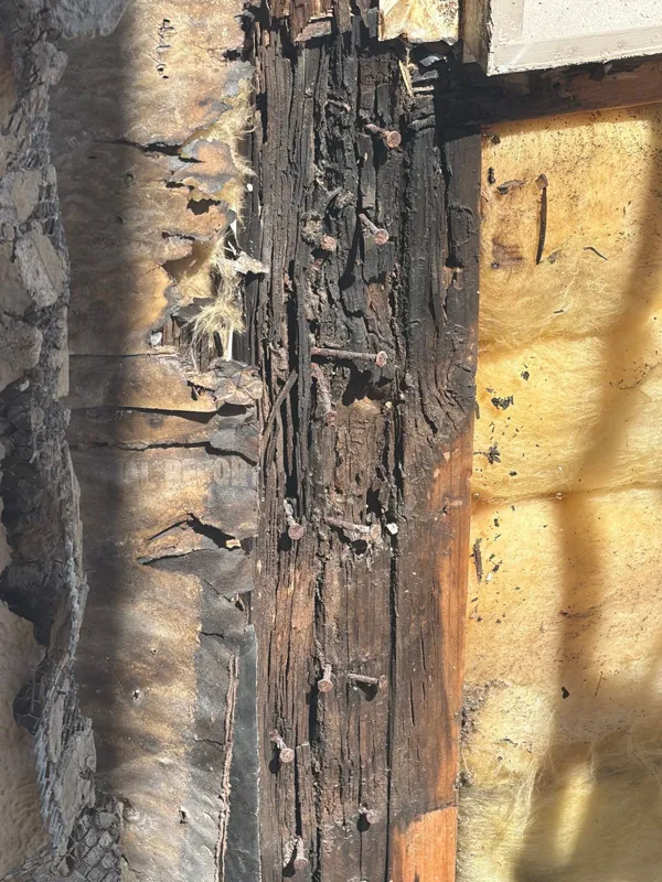Close view of wood and an opened window surround