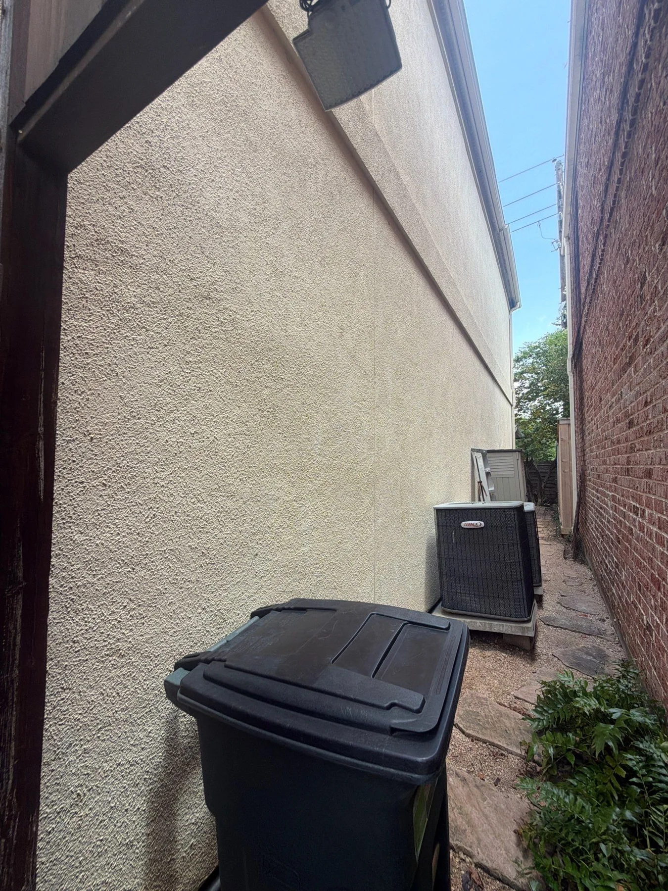 stucco wall along a side passage