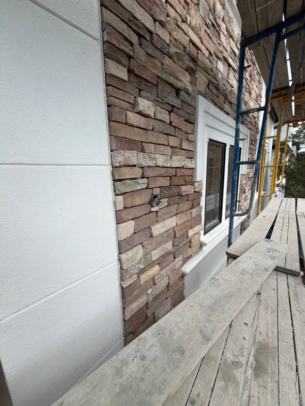 Stone exterior and adjacent wall in a later view