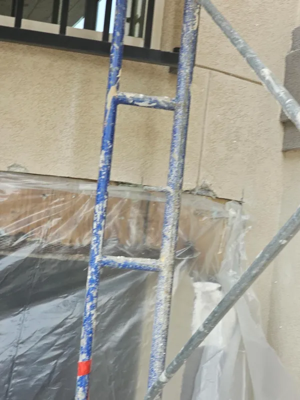 Protected exterior surface beside a bay window