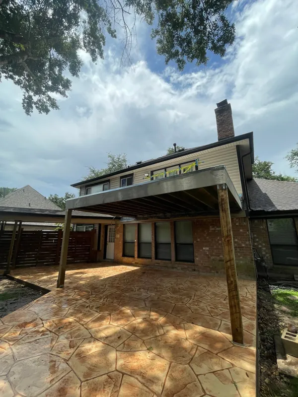 Elevated deck and railing along the back of a home