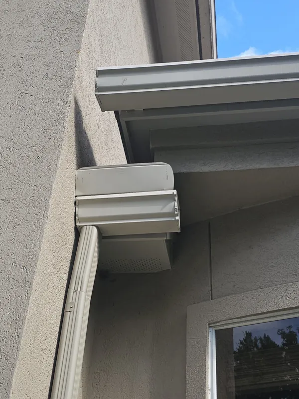 Stucco wall and projecting trim beside a window