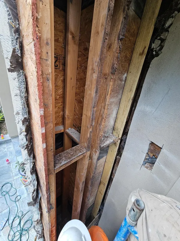 Wood and exterior layers visible during repair work