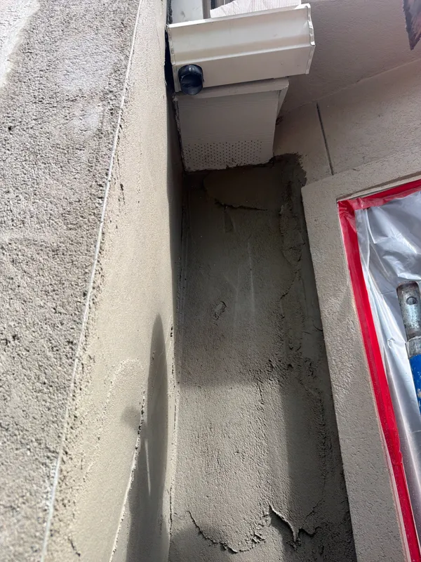 Repair coating along a narrow exterior wall section