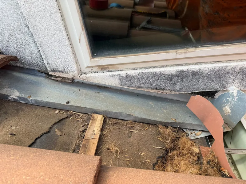 Exposed material beneath a window sill