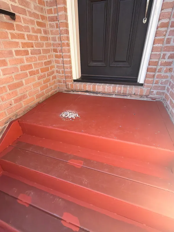 Red coating applied at the upper stair landing